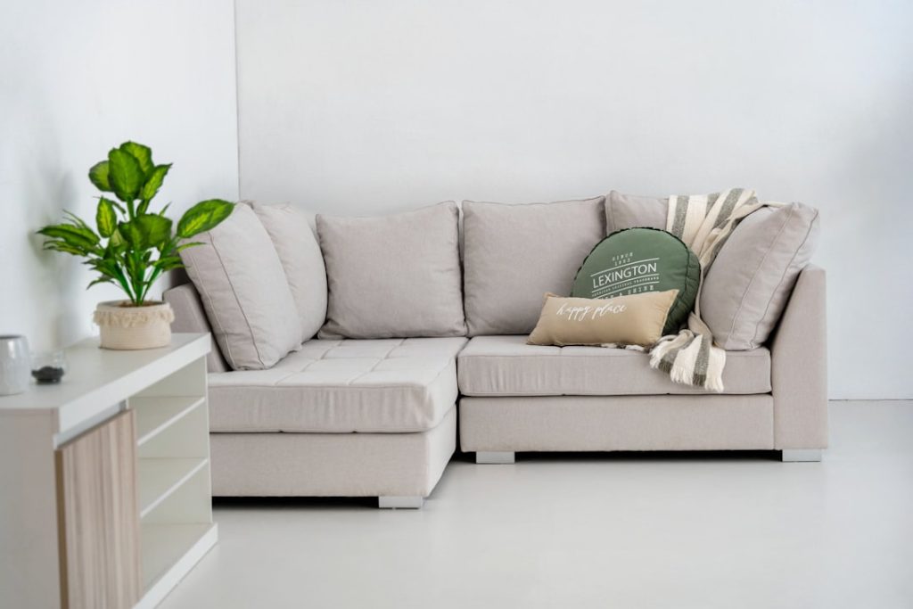 Sectional couch in a modern NYC living room before professional upholstery cleaning